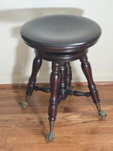 Antique-Piano-Stool-with-Claw-Feet-and-Glass-Ball-Casters