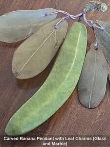 Carved-Banana-Pendant-with-Leaf-Charms-Glass-and-Marble-third-image