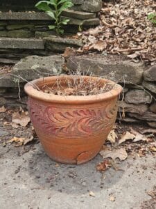 Terracotta-Planter-with-Embossed-Floral-Motif-and-Crack