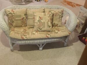 White-Wicker-Loveseat-with-Floral-Patchwork-Cushions
