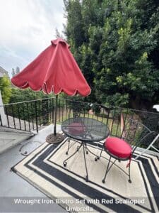 Wrought-Iron-Bistro-Set-with-Red-Scalloped-Umbrella
