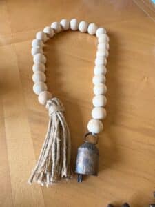 Wooden-Bead-Garland-with-Bell-and-Tassel