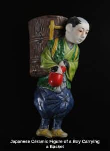 Japanese-Ceramic-Figure-of-a-Boy-Carrying-a-Basket