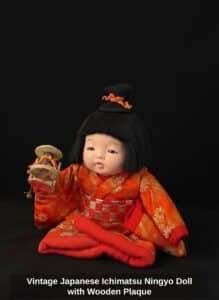Vintage-Japanese-Ichimatsu-Ningyo-Doll-with-Wooden-Plaque-second-image