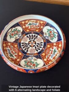 Vintage-Japanese-Imari-plate-decorated-with-alternating-landscape-and-foliate-panels-in-traditional-red-and-blue-colors