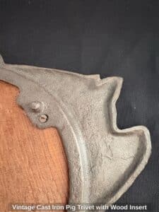 Vintage-Cast-Iron-Pig-Trivet-with-Wood-Insert-second-image