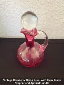 Vintage-Cranberry-Glass-Cruet-with-Clear-Glass-Stopper-and-Applied-Handle