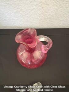 Vintage-Cranberry-Glass-Cruet-with-Clear-Glass-Stopper-and-Applied-Handle-third-image