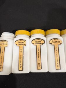 Vintage-Griffiths-Milk-Glass-Spice-Jar-Set-with-Yellow-Lids-second-image