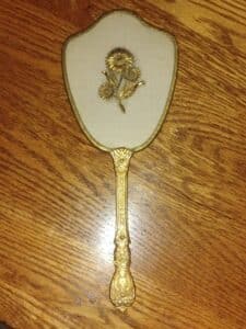 Vintage-Gold-Tone-Hand-Held-Vanity-Mirror-with-Floral-Applique-and-Tassel